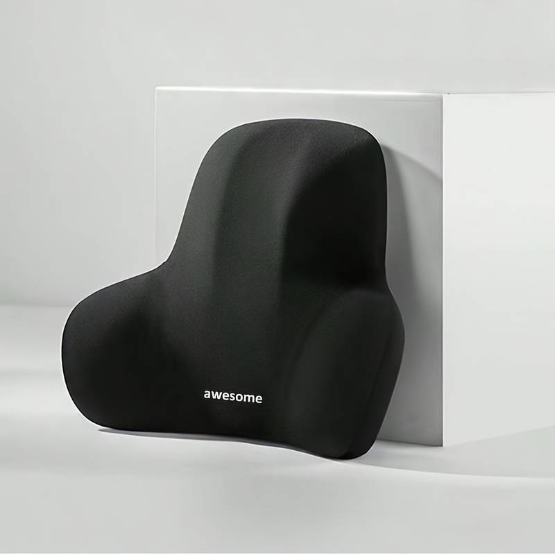 Ländryggsstöd placerat mot ryggstöd på stol