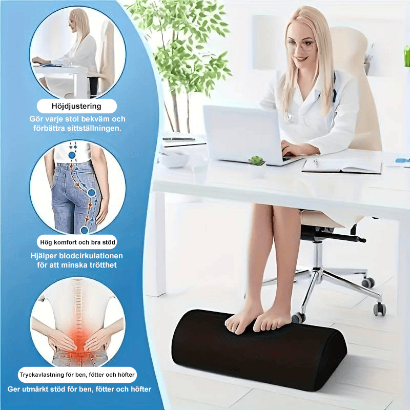 Person som vilar fötterna på fotstöd vid skrivbord