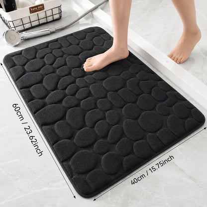 Halkfri badmatta med mjuk stenstruktur i storleken 60 × 40 cm för badrum.