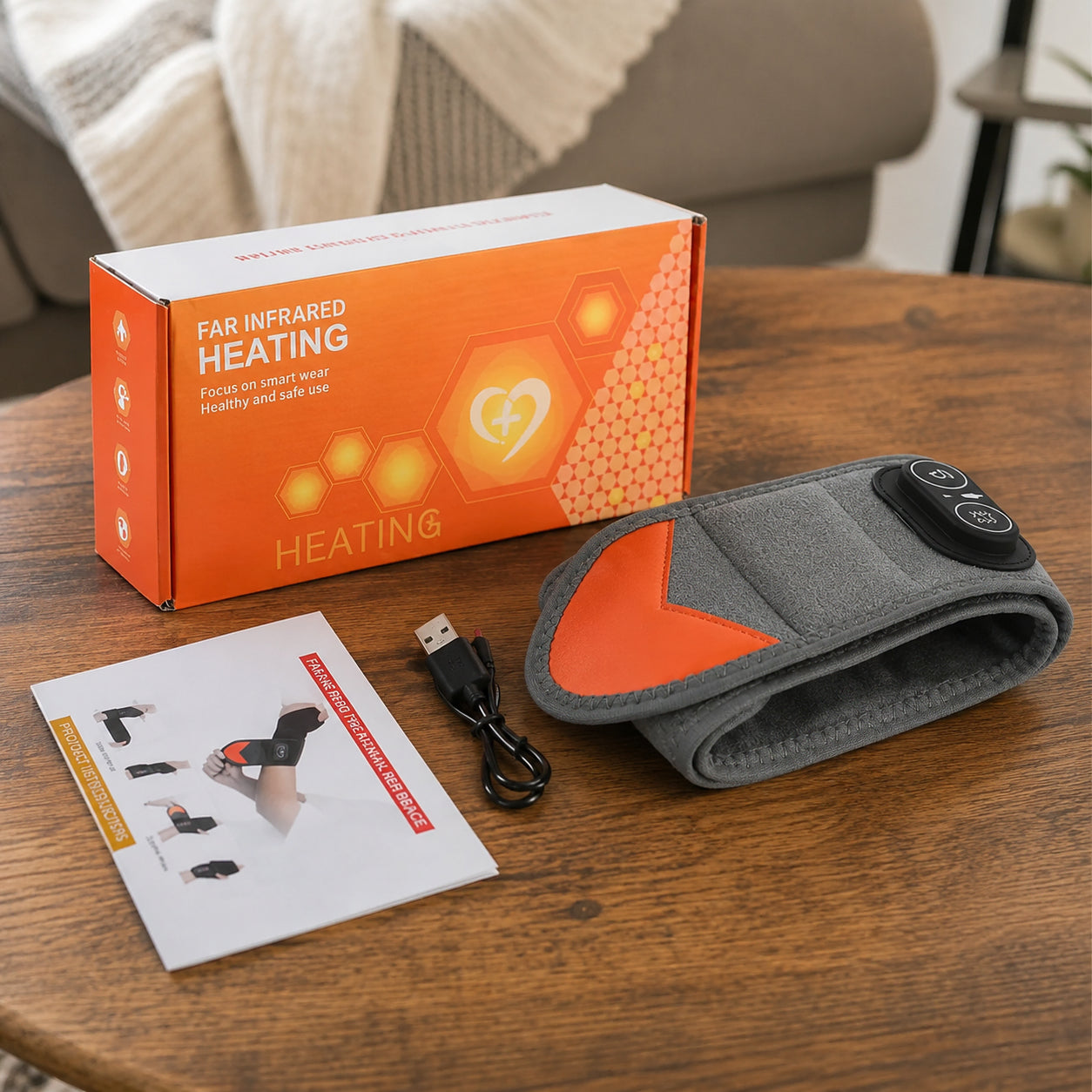 Handledsstöd med rödljusterapi, värme och vibration tillsammans med laddkabel, manual och förpackning.