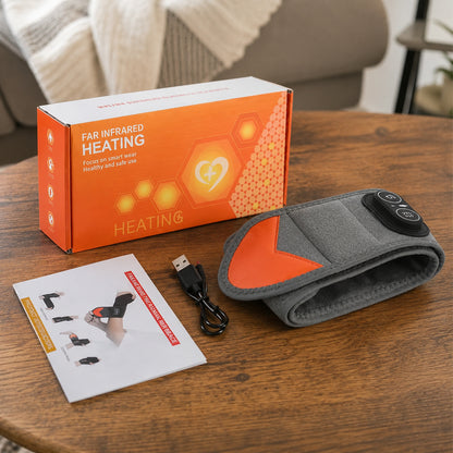 Handledsstöd med rödljusterapi, värme och vibration tillsammans med laddkabel, manual och förpackning.