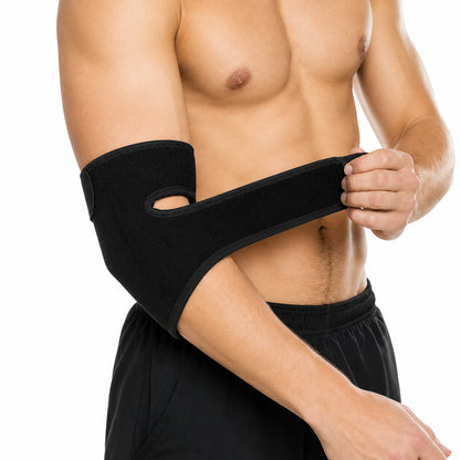 Justerbart armbågsstöd med kardborreband som ger kompression och stöd runt armbågen.