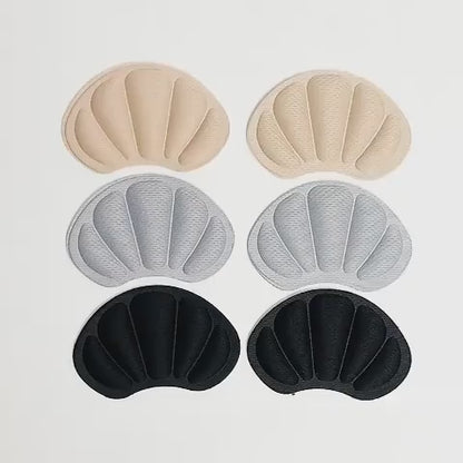 Video som visar olika färger av mjuka självhäftande hälskydd samt hur de placeras i skon för att minska skav