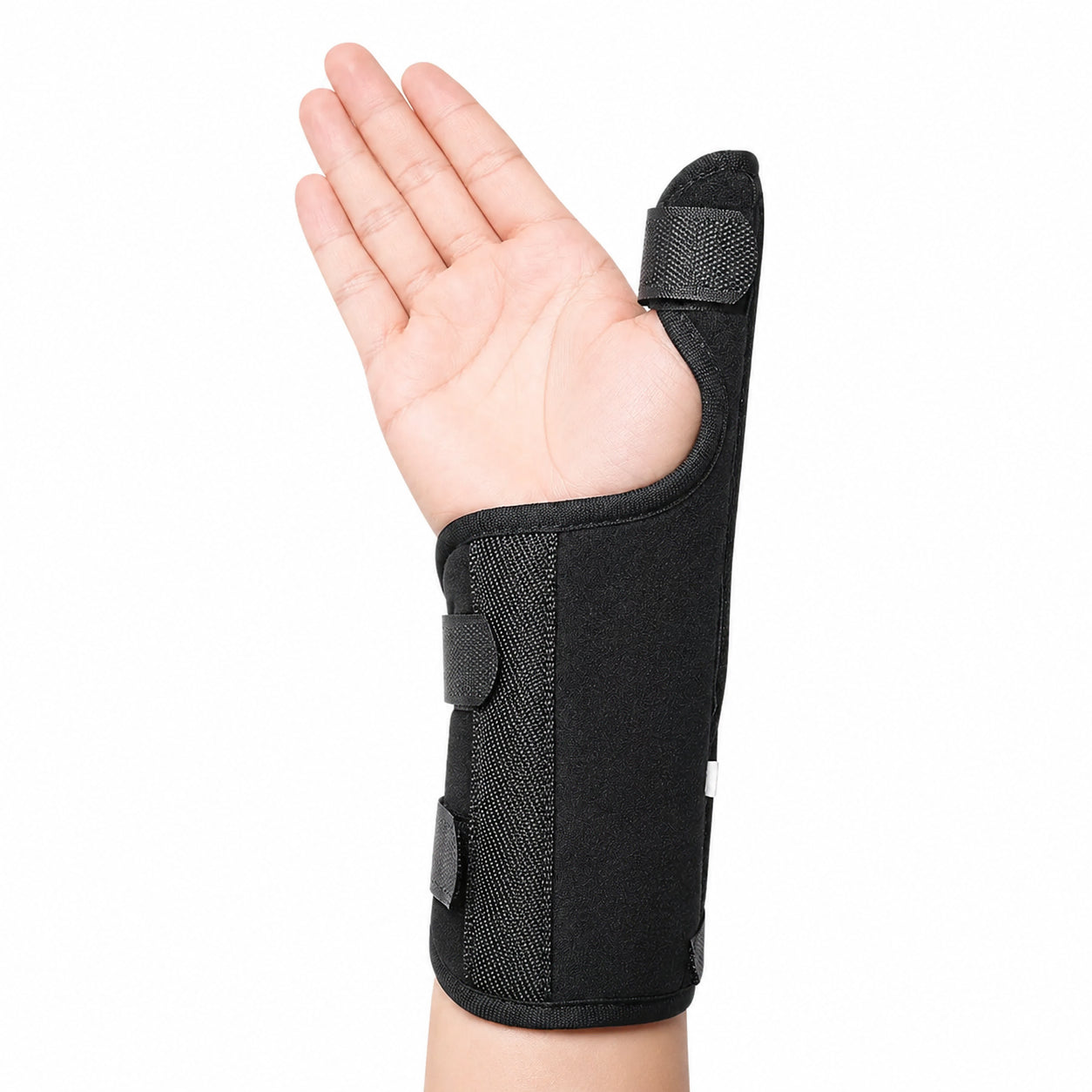 Handledsstöd med tumstöd som stabiliserar handled och tumme med justerbara kardborreband.